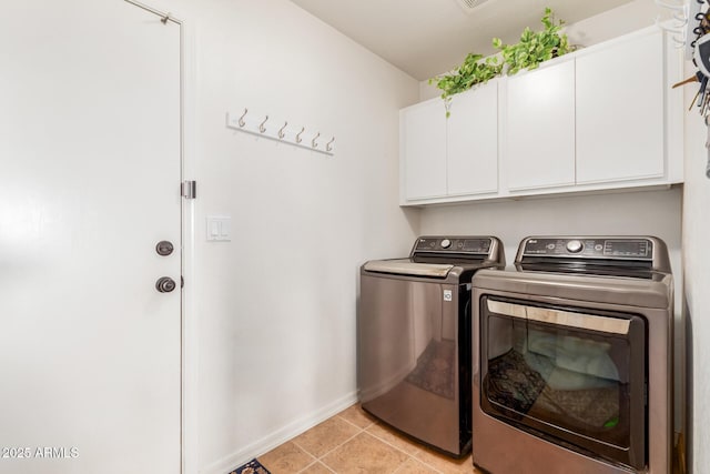 clothes washing area featuring cabinet space, independent washer and dryer, baseboards, and light tile patterned flooring