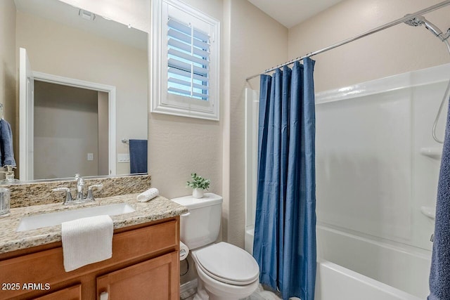 full bathroom featuring toilet, vanity, and shower / bath combination with curtain