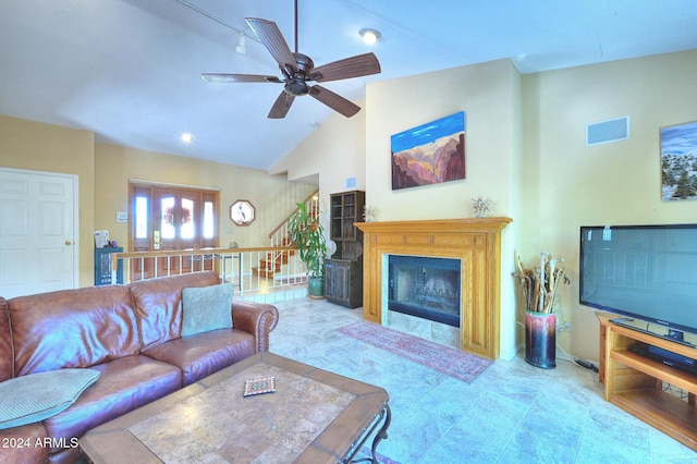 living room featuring ceiling fan and lofted ceiling