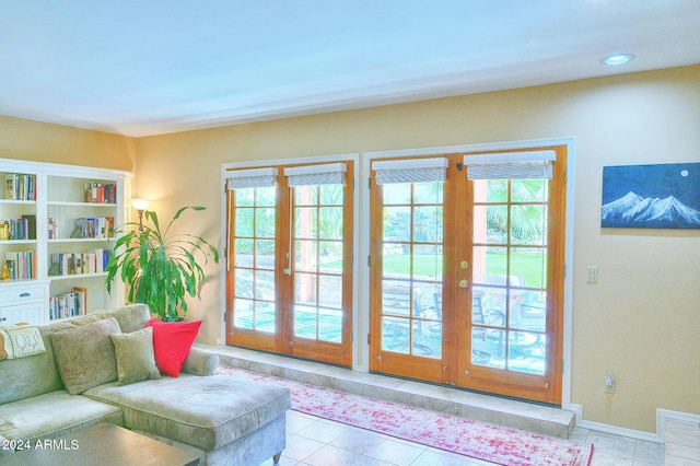 entryway featuring light tile patterned floors and french doors