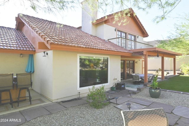 rear view of house with a patio area