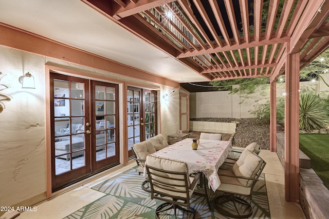 view of patio / terrace with french doors and a pergola