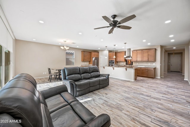 1344 N Claiborne, Mesa, AZ 85205 - living room with recessed lighting, baseboards, light wood-type flooring, a chandelier, and ceiling fan