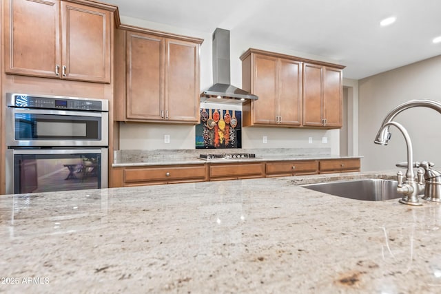1344 N Claiborne, Mesa, AZ 85205 - kitchen with wall chimney exhaust hood, stainless steel appliances, a sink, light stone countertops, and recessed lighting