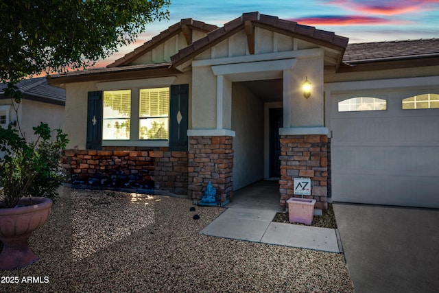 1344 N Claiborne, Mesa, AZ 85205 - view of front of house with stone siding, a garage, and stucco siding