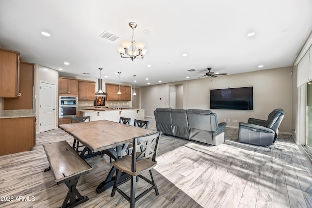 1344 N Claiborne, Mesa, AZ 85205 - dining space featuring recessed lighting, a chandelier, ceiling fan, light wood-type flooring, and baseboards