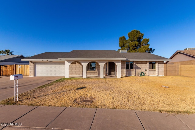 ranch-style home featuring a garage