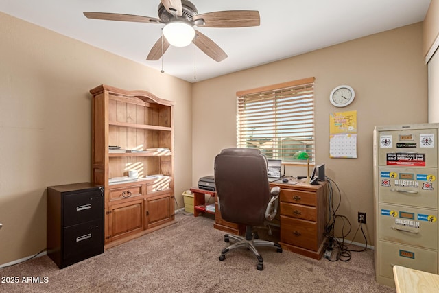 office area with ceiling fan and light carpet