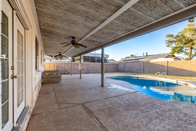 view of pool with ceiling fan and a patio area