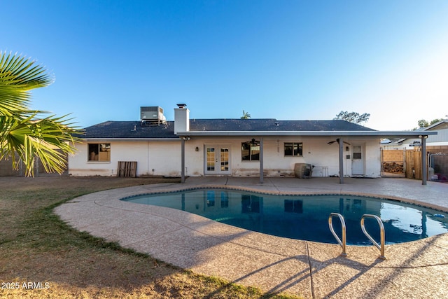 view of pool with a patio area, ceiling fan, central air condition unit, and french doors