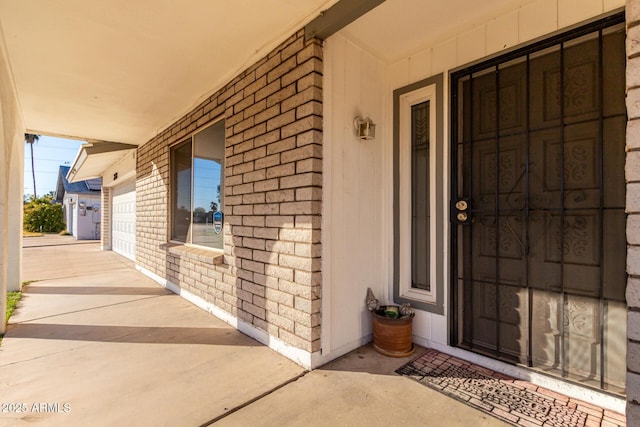 doorway to property featuring a garage