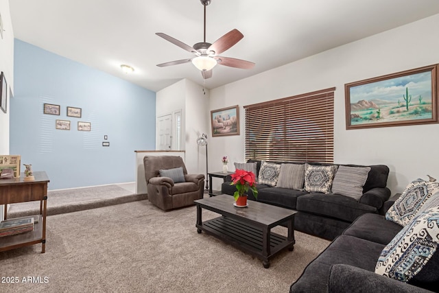 carpeted living room featuring ceiling fan