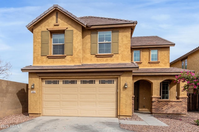 traditional home featuring a porch, fence, a garage, and stucco siding