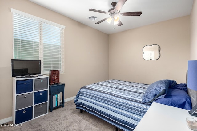 bedroom featuring carpet flooring, baseboards, visible vents, and ceiling fan