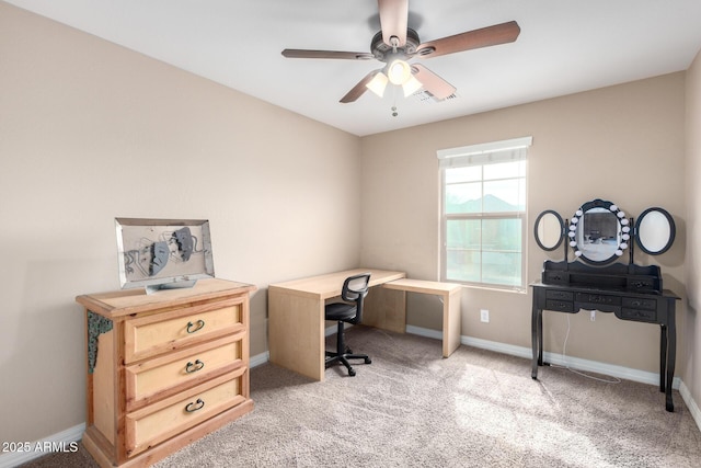 office with light colored carpet, visible vents, baseboards, and ceiling fan