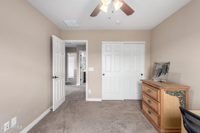 bedroom with a ceiling fan, baseboards, visible vents, a closet, and light carpet