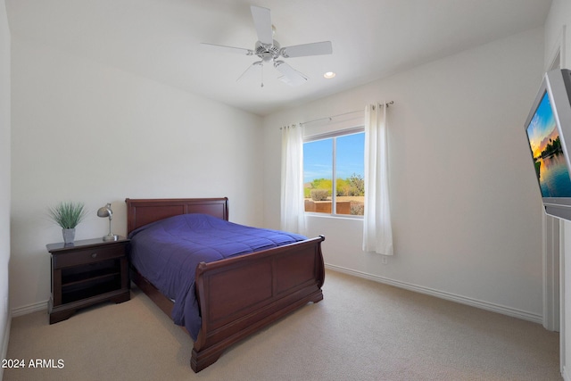 carpeted bedroom featuring ceiling fan