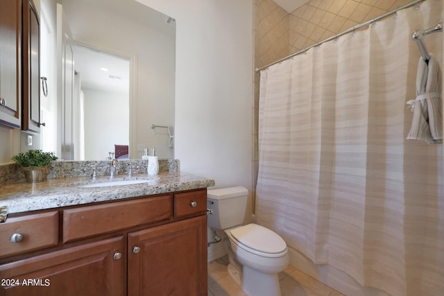 bathroom with tile patterned floors, vanity, and toilet