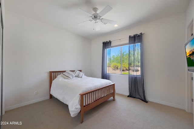 carpeted bedroom featuring ceiling fan