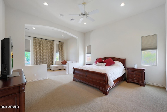 bedroom featuring ceiling fan and light colored carpet