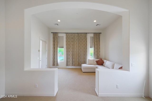 living room with light colored carpet