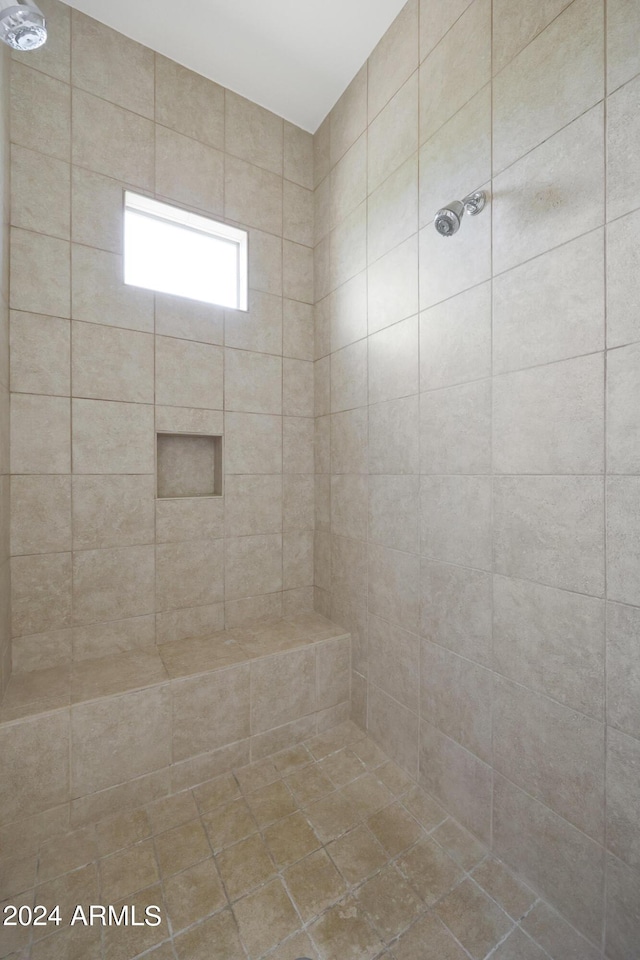 bathroom featuring tiled shower