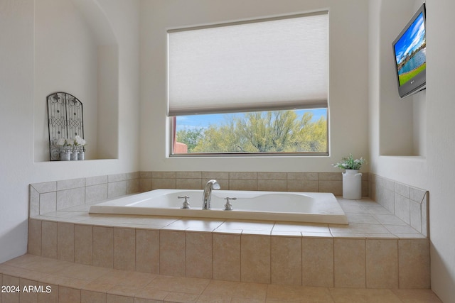 bathroom with tiled bath