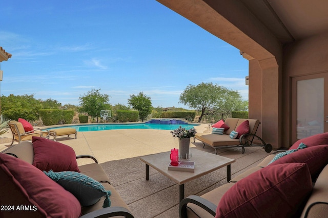 view of swimming pool with a patio and an outdoor hangout area