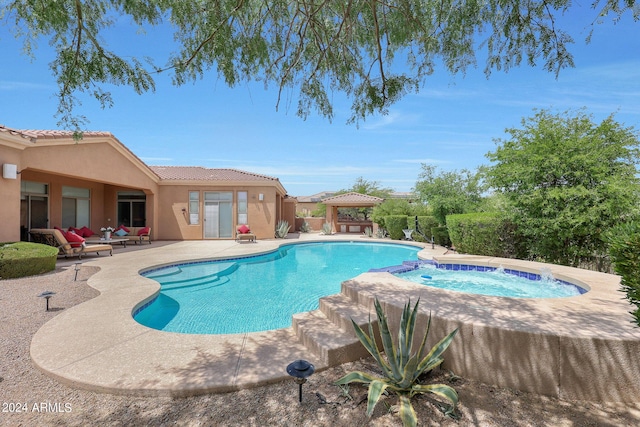 view of pool featuring a gazebo, an in ground hot tub, and a patio