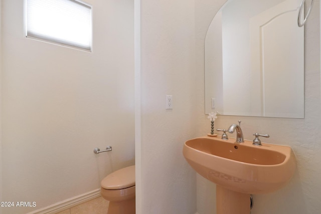 bathroom featuring tile patterned floors, toilet, and sink