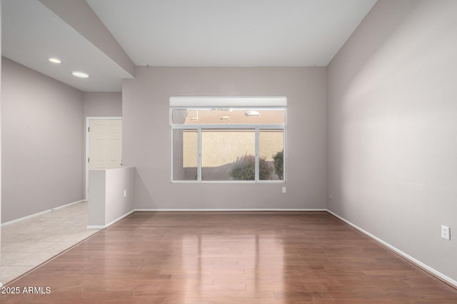 unfurnished room with light hardwood / wood-style floors