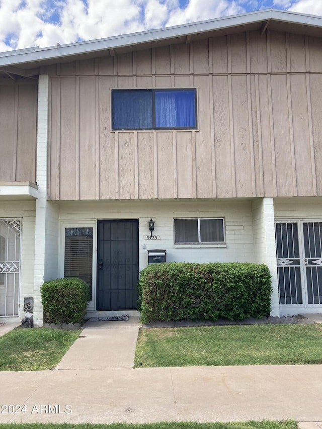 multi unit property with brick siding and board and batten siding