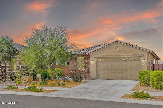 2187 W Burnside Trl, Phoenix, AZ 85085 - view of front of property with a tile roof, a garage, driveway, and stucco siding