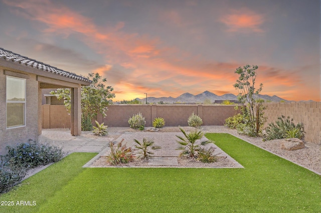 2187 W Burnside Trl, Phoenix, AZ 85085 - yard at dusk with a patio area