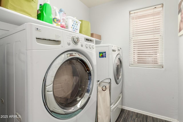 laundry room featuring dark wood-style floors, laundry area, independent washer and dryer, and baseboards