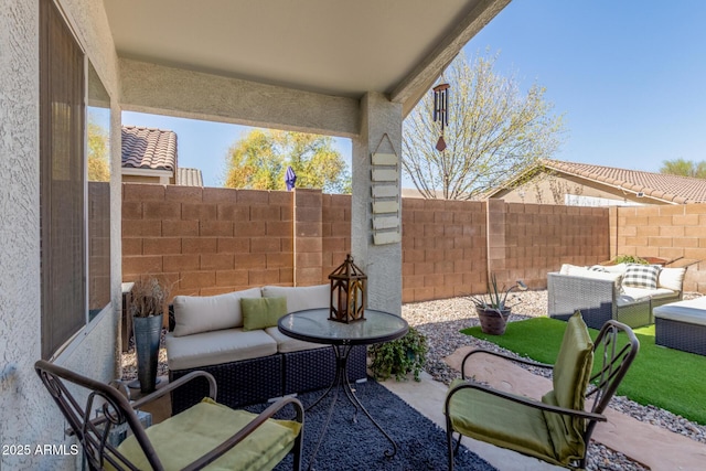 view of patio featuring a fenced backyard and outdoor lounge area