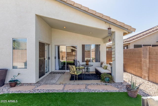 view of patio / terrace featuring fence