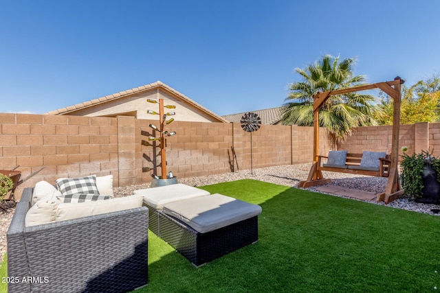 view of yard featuring a patio area, a fenced backyard, and an outdoor living space