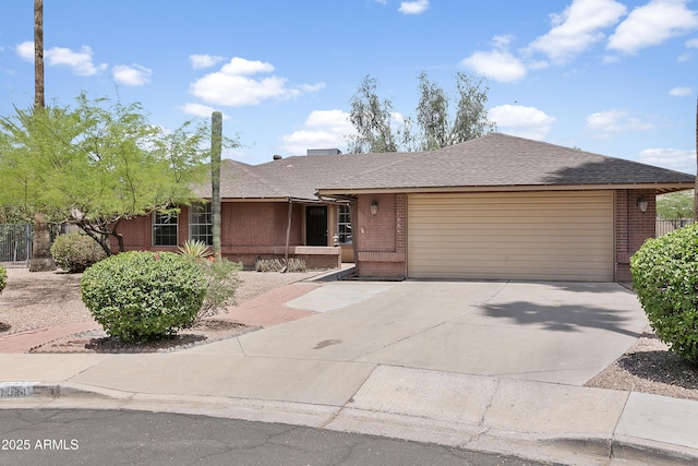 1334 S Glenview Cir, Mesa, AZ 85204 - single story home featuring brick siding, a garage, driveway, and roof with shingles