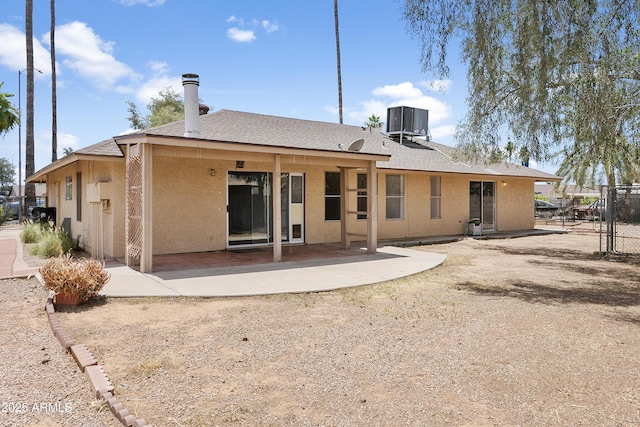 1334 S Glenview Cir, Mesa, AZ 85204 - back of house featuring stucco siding, central AC, a patio, and roof with shingles