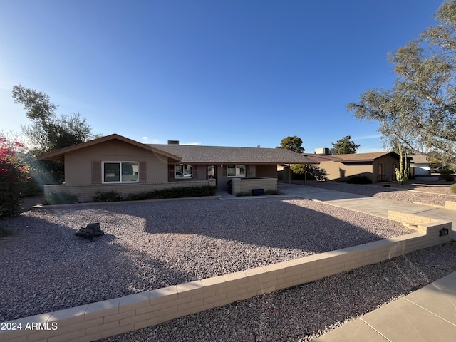 ranch-style house with a carport