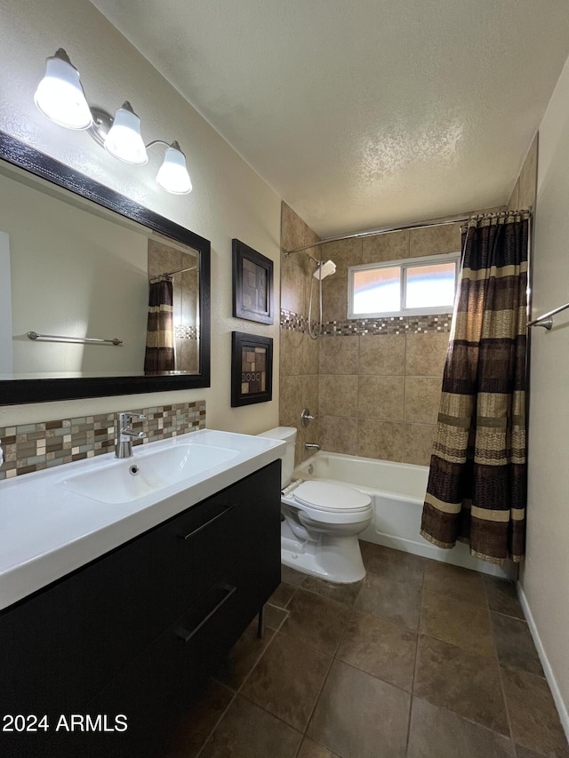 full bathroom featuring vanity, tile patterned flooring, toilet, shower / bath combo with shower curtain, and tasteful backsplash