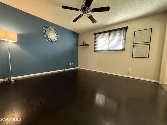 unfurnished room featuring ceiling fan, a textured ceiling, and hardwood / wood-style flooring