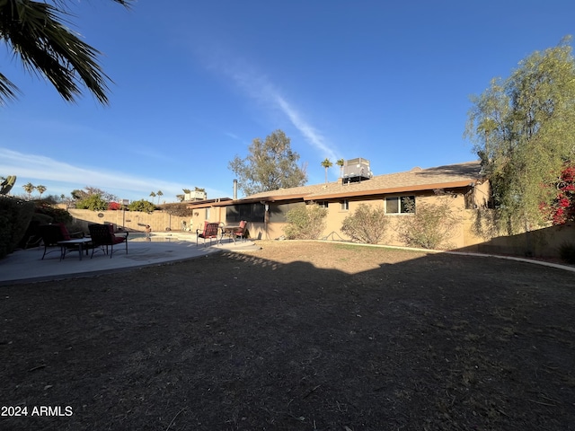 rear view of property featuring a patio