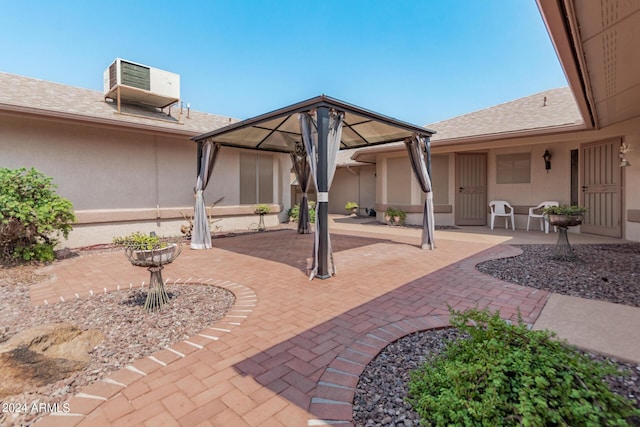 view of patio / terrace with a gazebo and central air condition unit