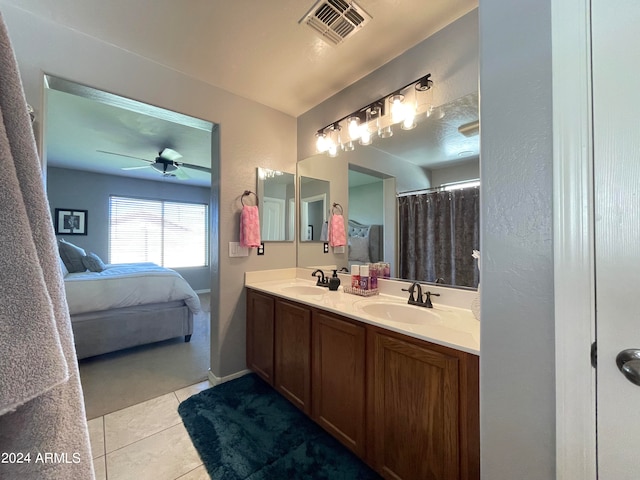 bathroom featuring tile patterned flooring, vanity, and ceiling fan