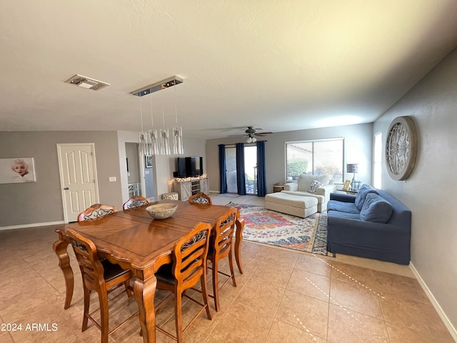 dining room featuring ceiling fan and light tile patterned flooring