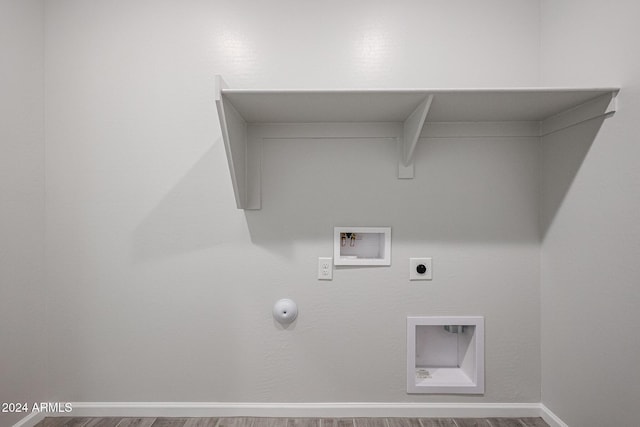 laundry area with hookup for an electric dryer, washer hookup, hookup for a gas dryer, and hardwood / wood-style floors