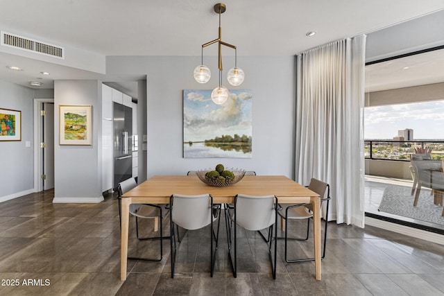 dining room with baseboards, recessed lighting, and visible vents