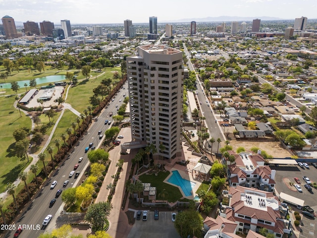 bird's eye view featuring a view of city and a water view